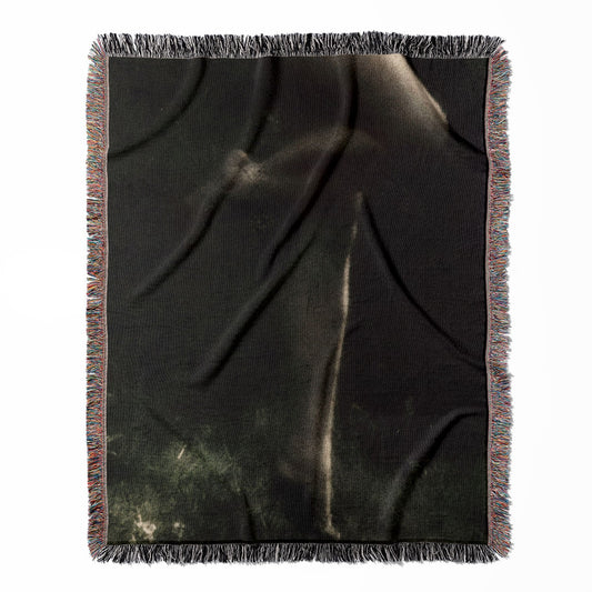 Midnight Forest woven throw blanket, crafted from 100% cotton, delivering a soft and cozy texture with a moody and dark theme for home decor.