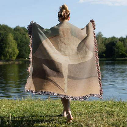 Minimalist Ballet Woven Throw Blanket Held on a Woman's Back Outside