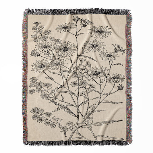 Minimalist Floral woven throw blanket, made with 100% cotton, providing a soft and cozy texture with a black and white flower for home decor.