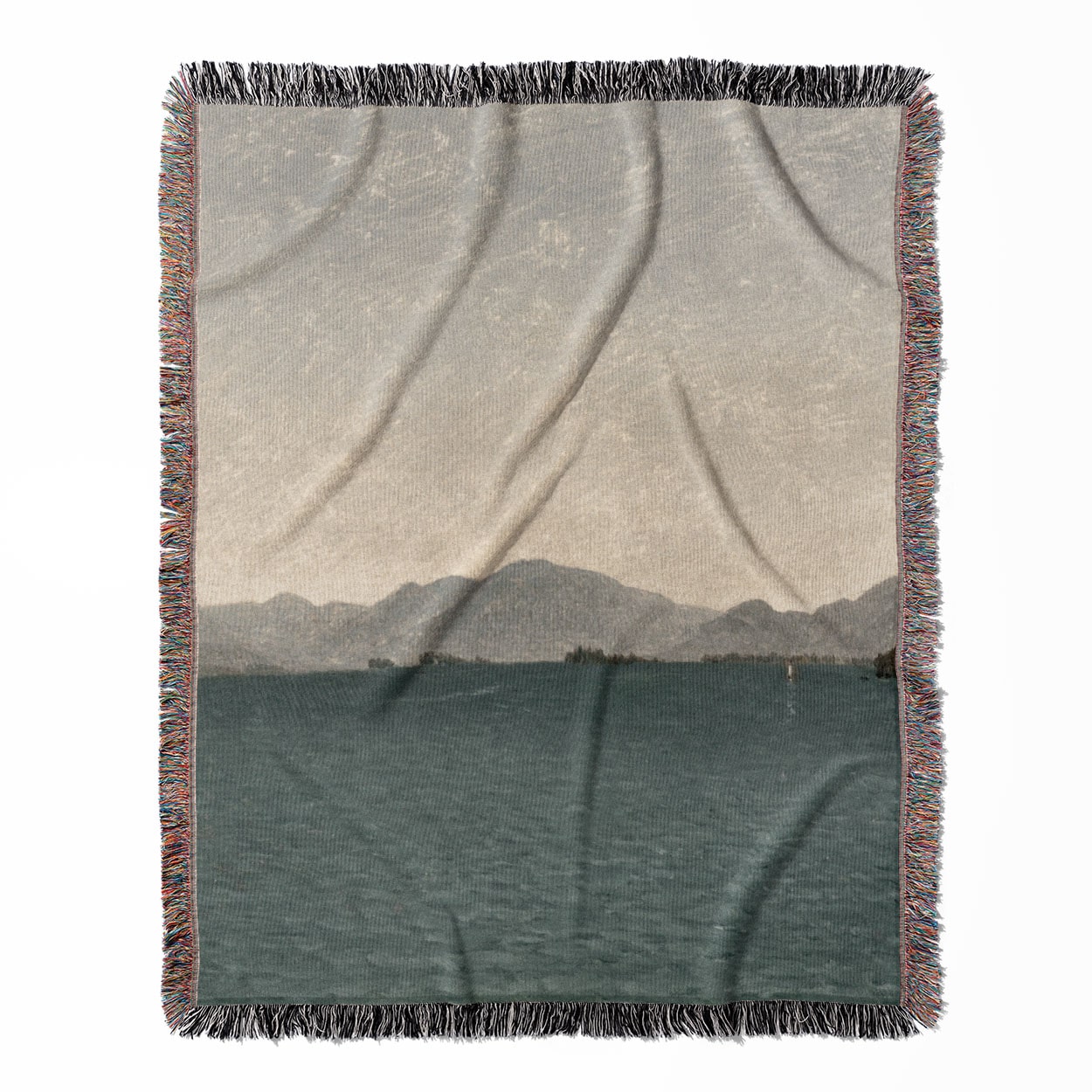 Minimalist Mountains woven throw blanket, made with 100% cotton, featuring a soft and cozy texture with a lake painting for home decor.