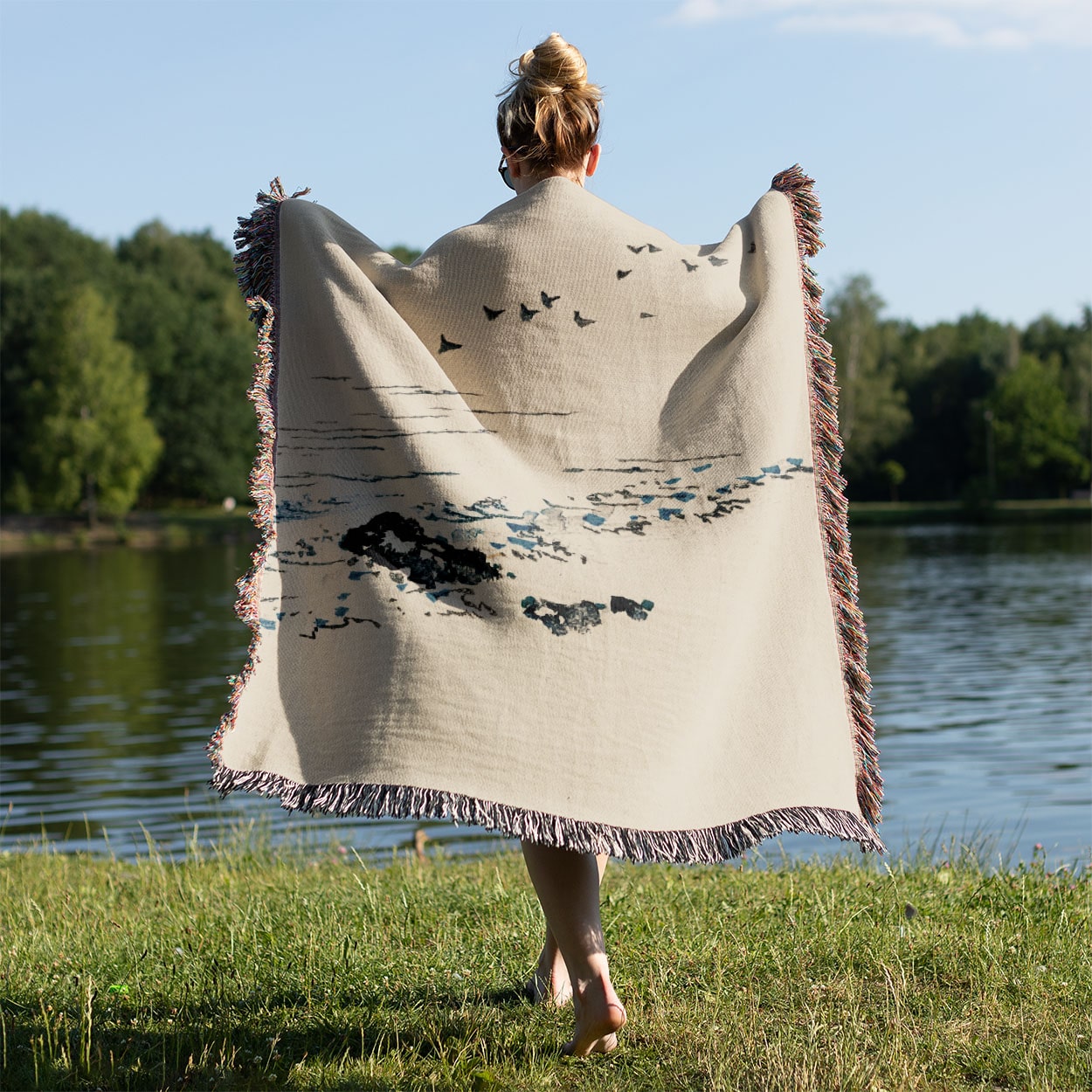 Minimalist Ocean Woven Blanket Held Up Outside