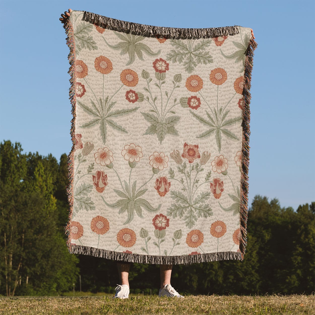 Minimalist Spring Flowers Woven Blanket Held on a Woman's Back Outside
