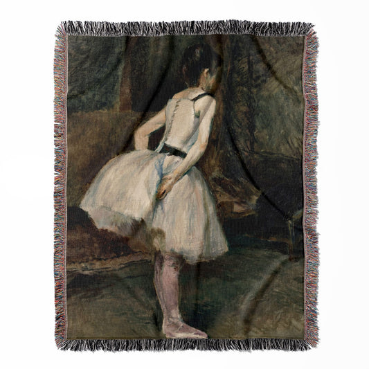 Moody Ballerina woven throw blanket, crafted from 100% cotton, offering a soft and cozy texture with a black and white dancer design for home decor.