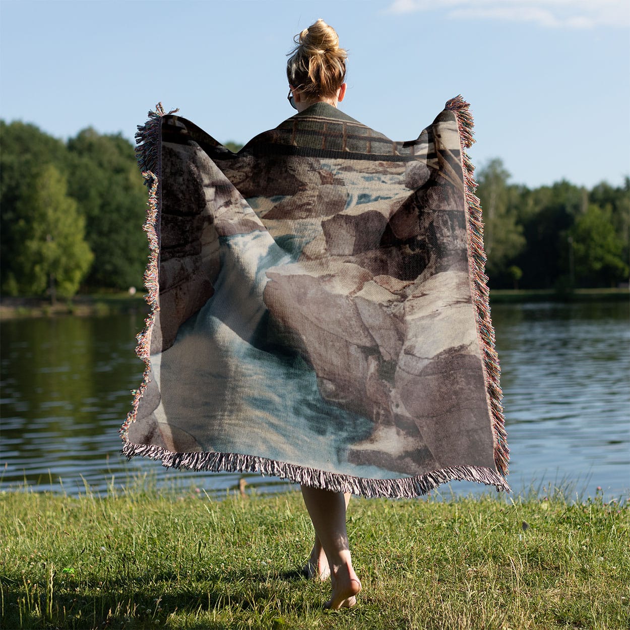Mountain River Woven Blanket Held Up Outside
