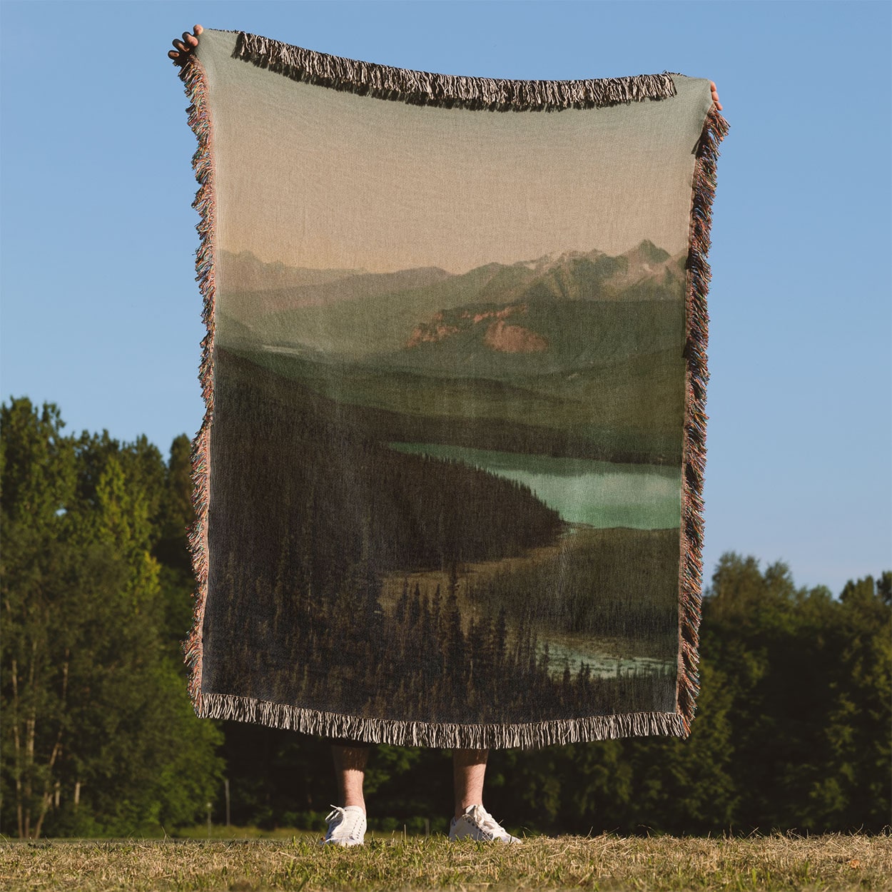 Mountains Woven Throw Blanket Held Up Outside