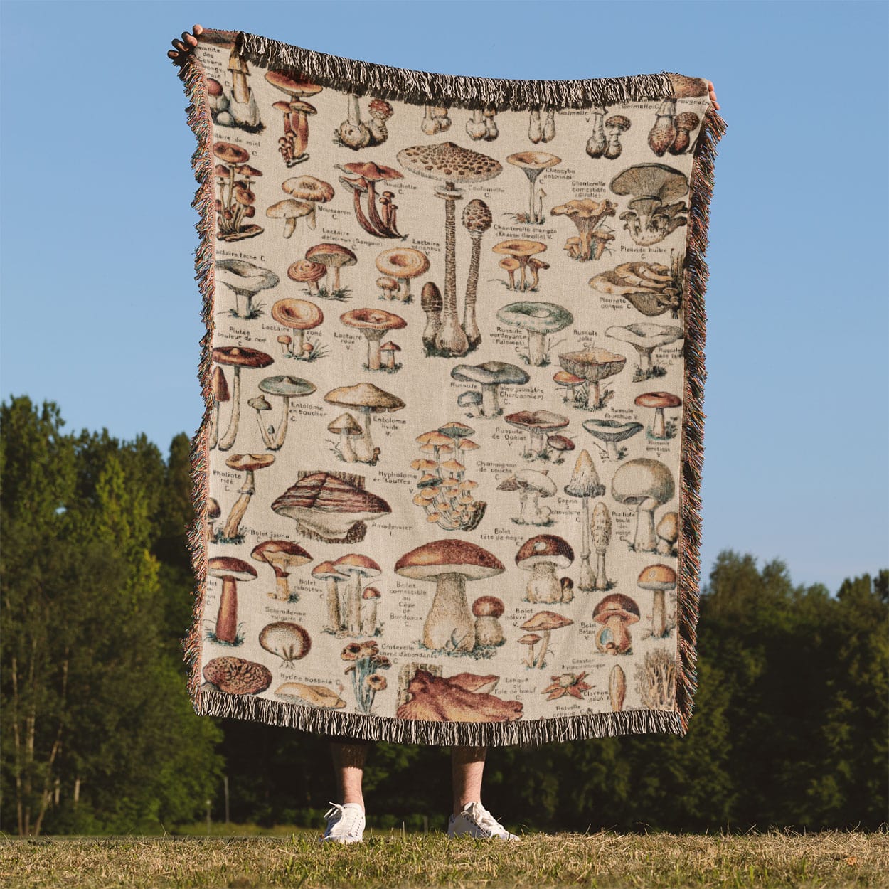 Mushroom Woven Blanket Held on a Woman's Back Outside