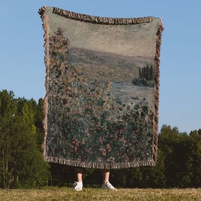 Muted Floral Woven Blanket Held on a Woman's Back Outside