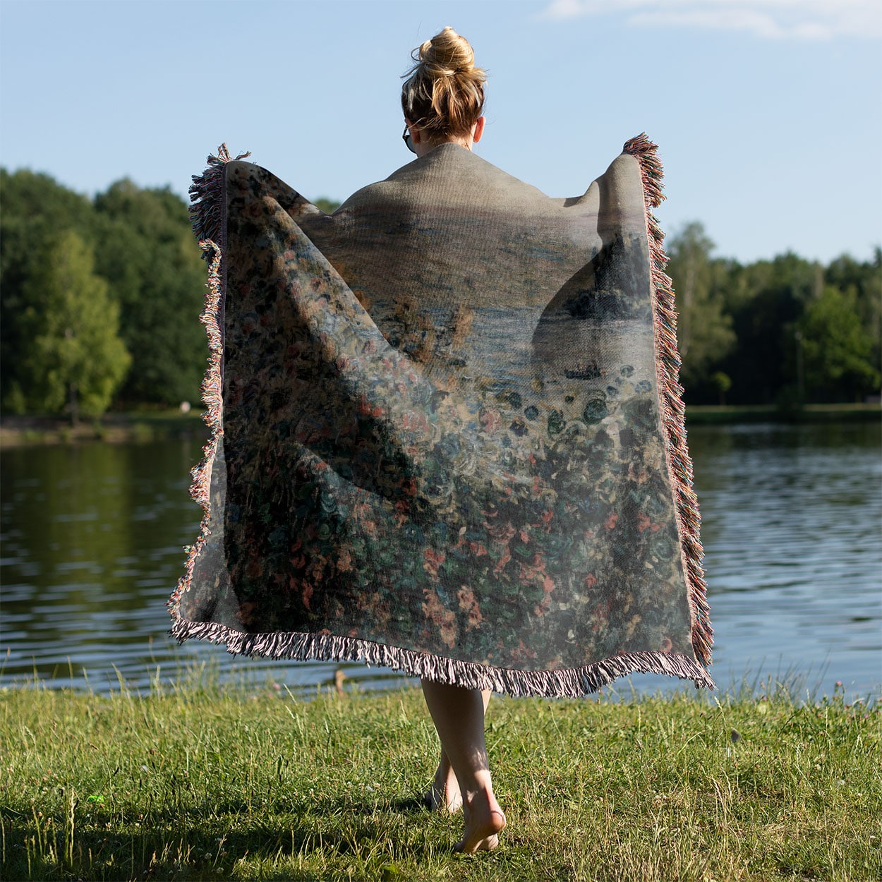 Muted Floral Woven Blanket Held Up Outside