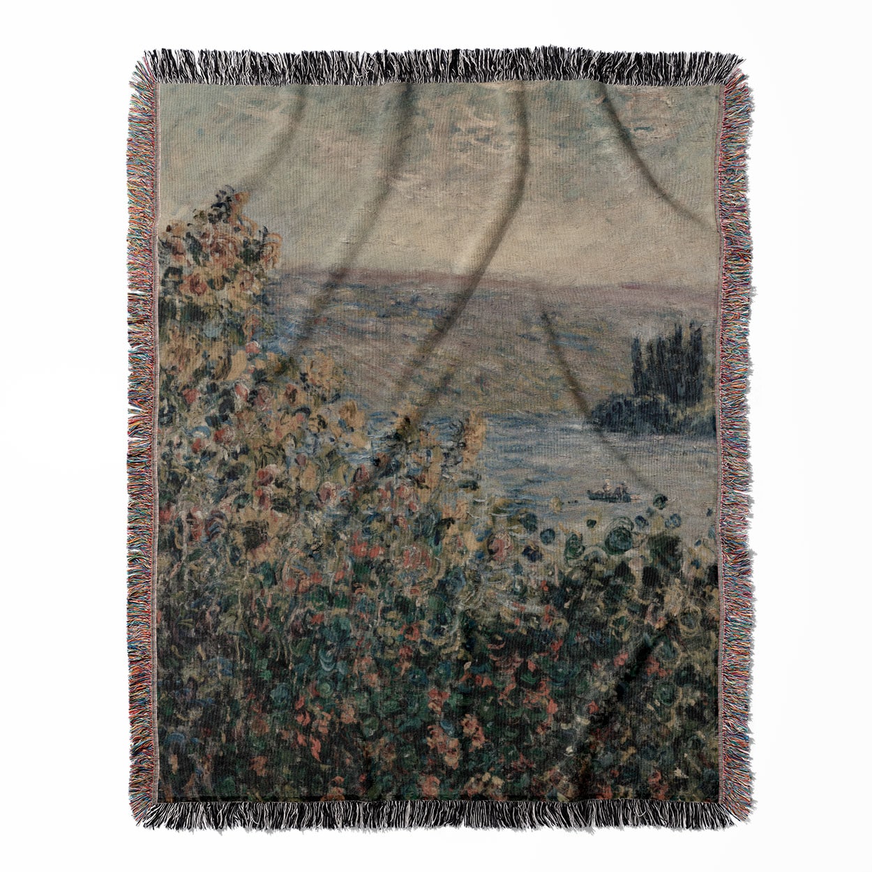 Muted Floral woven throw blanket, crafted from 100% cotton, offering a soft and cozy texture with green, pink, and red designs for home decor.
