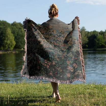 Muted Floral Woven Blanket Held Up Outside