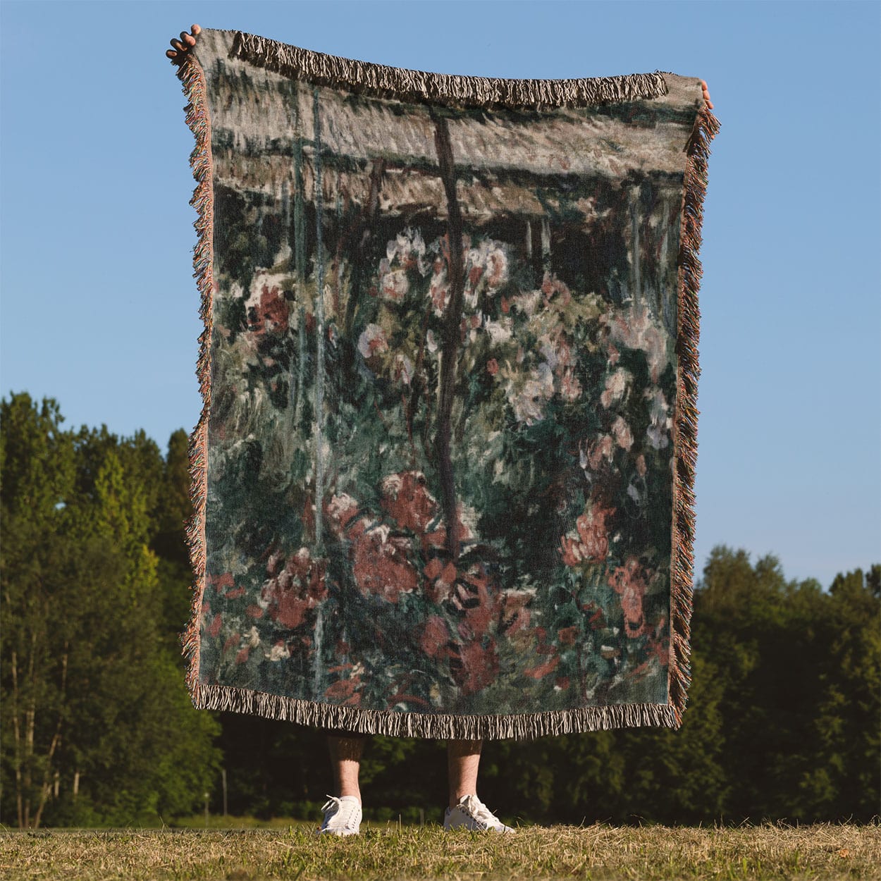 Muted Flowers Woven Throw Blanket Held Up Outside