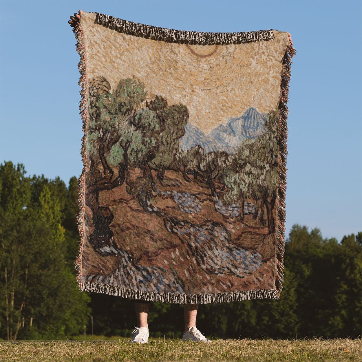 Nature Woven Blanket Held on a Woman's Back Outside