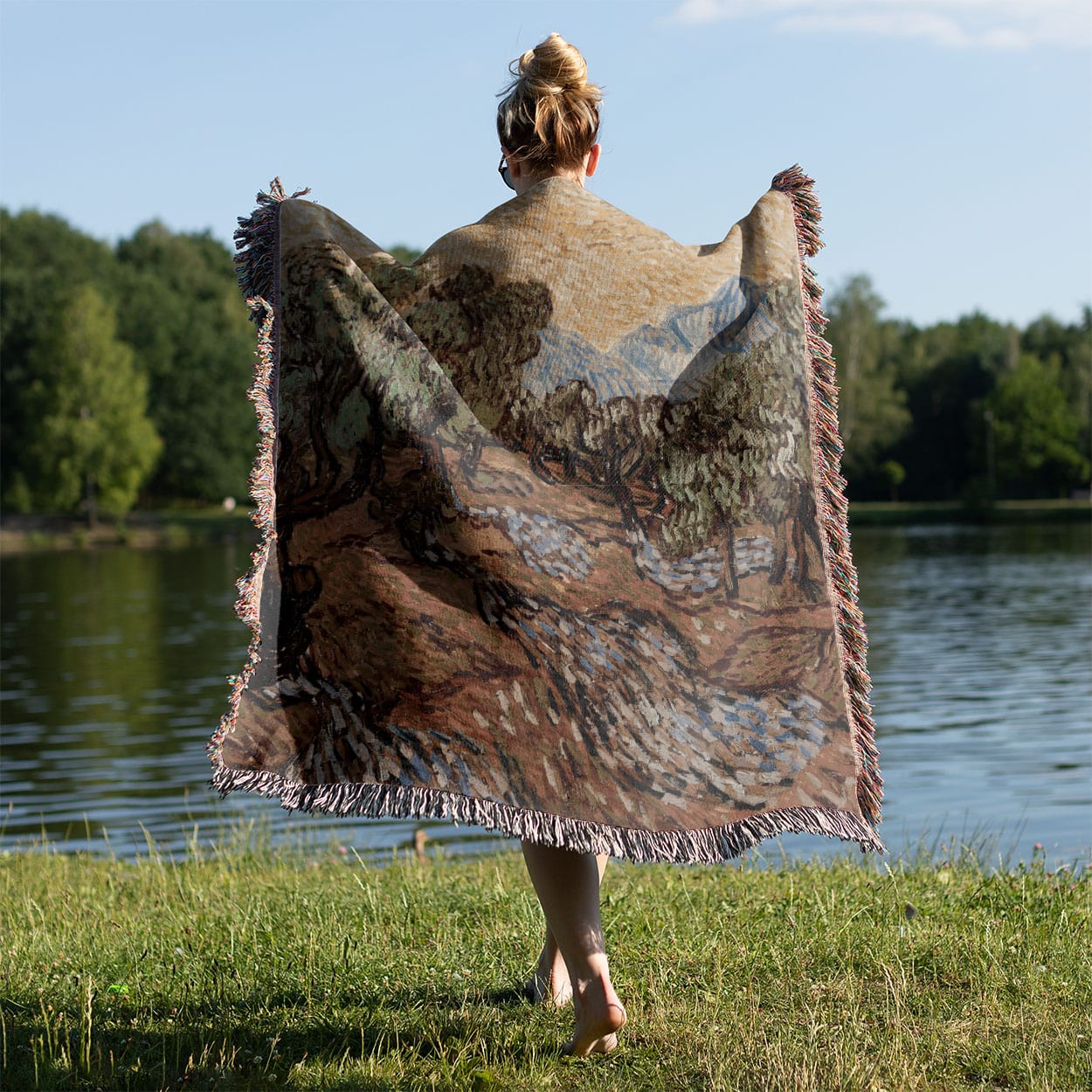 Nature Woven Throw Blanket Held on a Woman's Back Outside