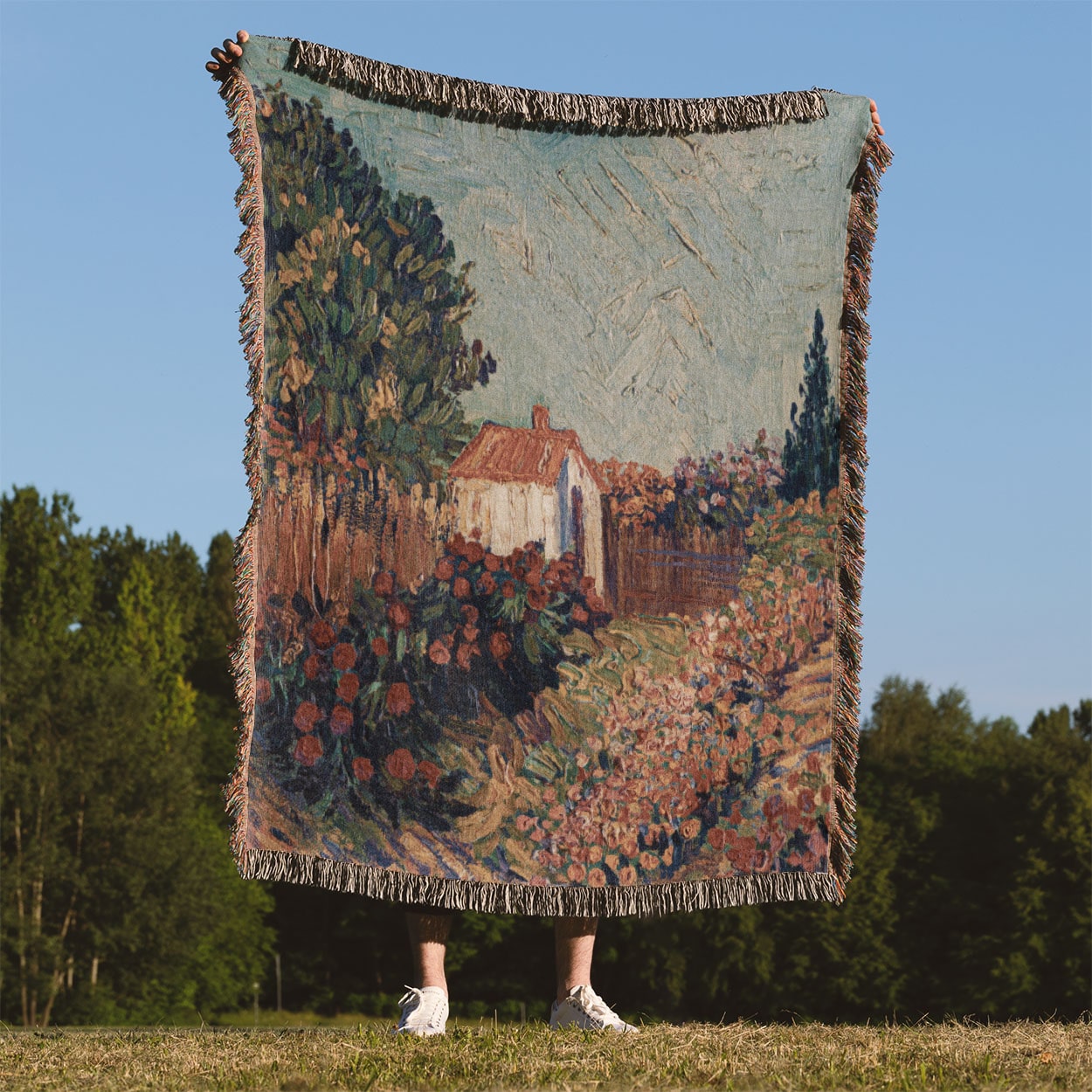 Nature Woven Blanket Held on a Woman's Back Outside