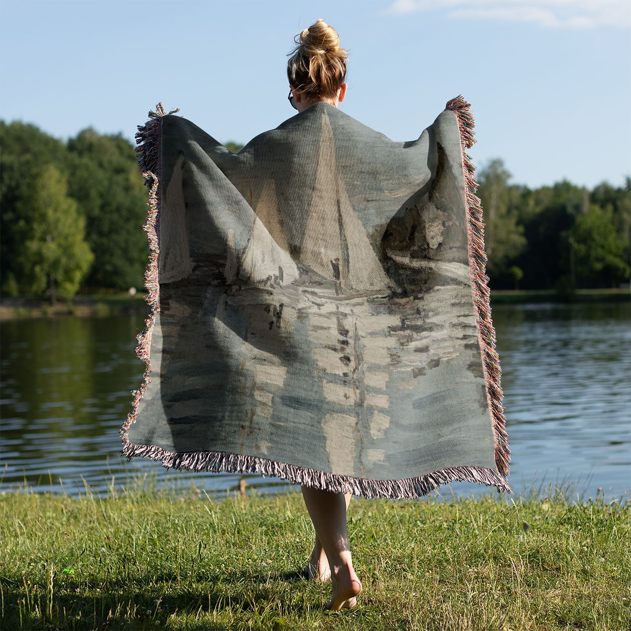 Nautical Woven Throw Blanket Held on a Woman's Back Outside