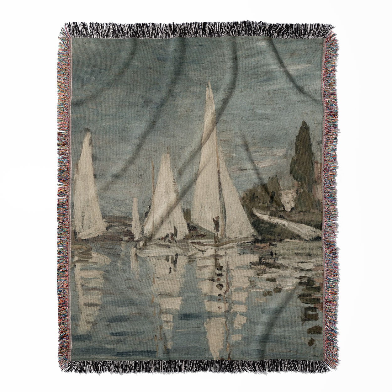 Nautical woven throw blanket, made with 100% cotton, providing a soft and cozy texture with sailboats for home decor.