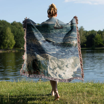 Ocean Woven Throw Blanket Held on a Woman's Back Outside