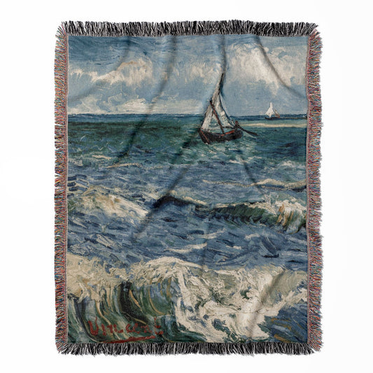 Ocean woven throw blanket, made with 100% cotton, offering a soft and cozy texture with a sailboat theme for home decor.