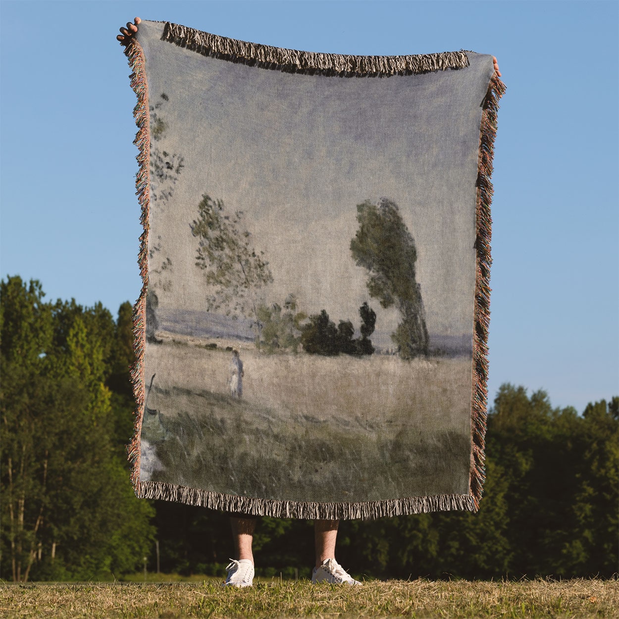 Old-Timey Get Away Woven Blanket Held on a Woman's Back Outside