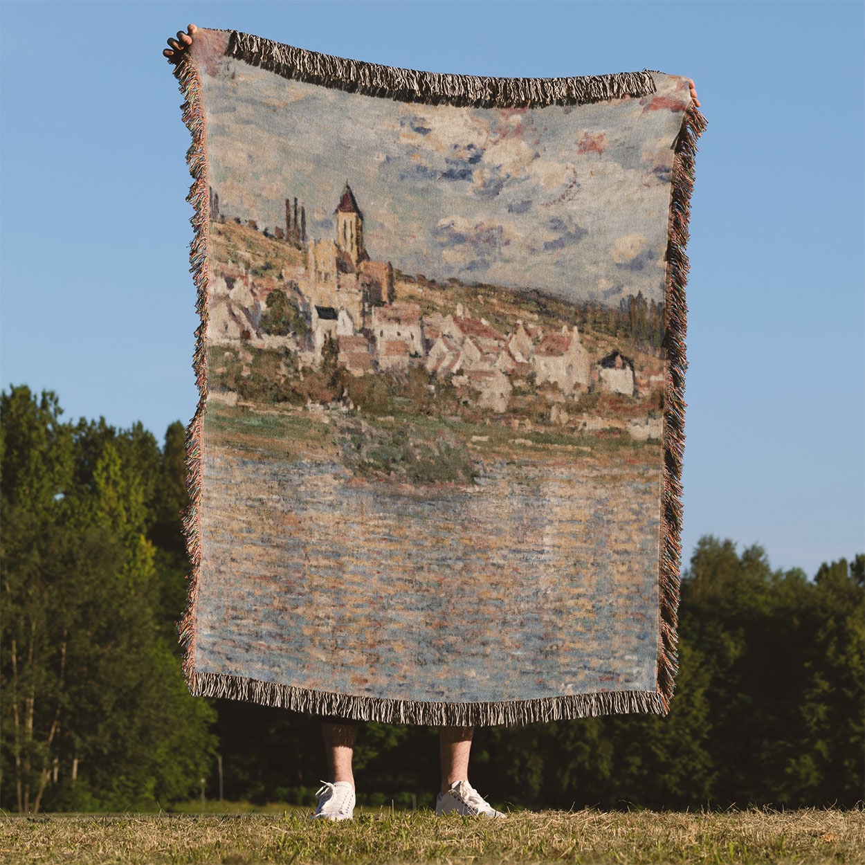 Paris Landscape Woven Throw Blanket Held Up Outside