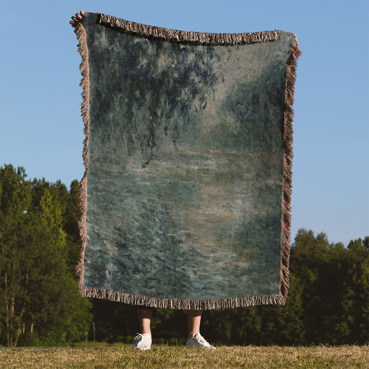 Peaceful Green Woven Throw Blanket Held Up Outside