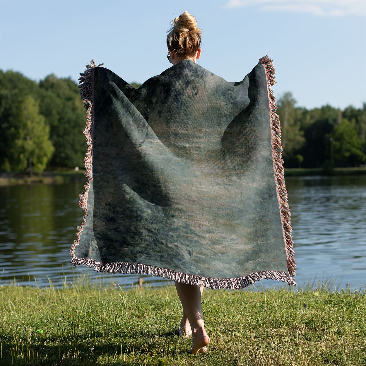 Peaceful Green Woven Throw Blanket Held on a Woman's Back Outside