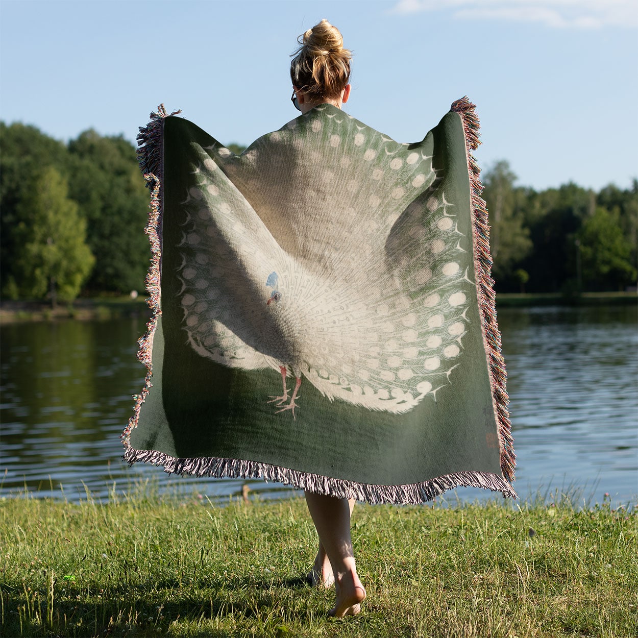 Peacock Feathers Woven Blanket Held Up Outside