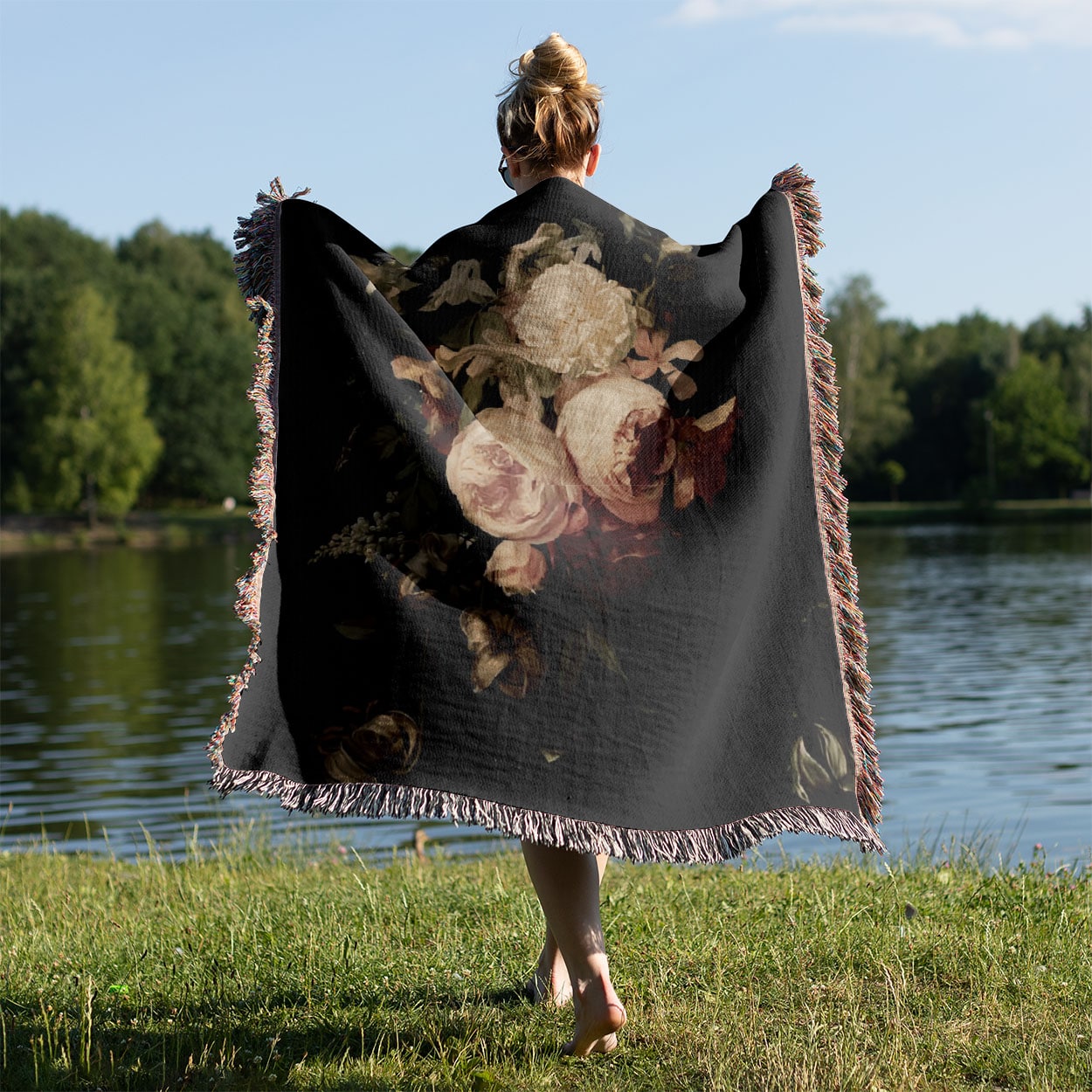 Peony Woven Throw Blanket Held on a Woman's Back Outside