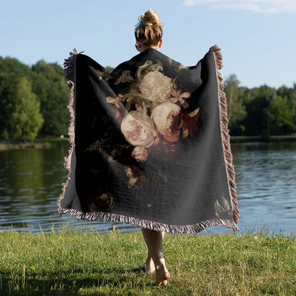 Peony Woven Throw Blanket Held on a Woman's Back Outside