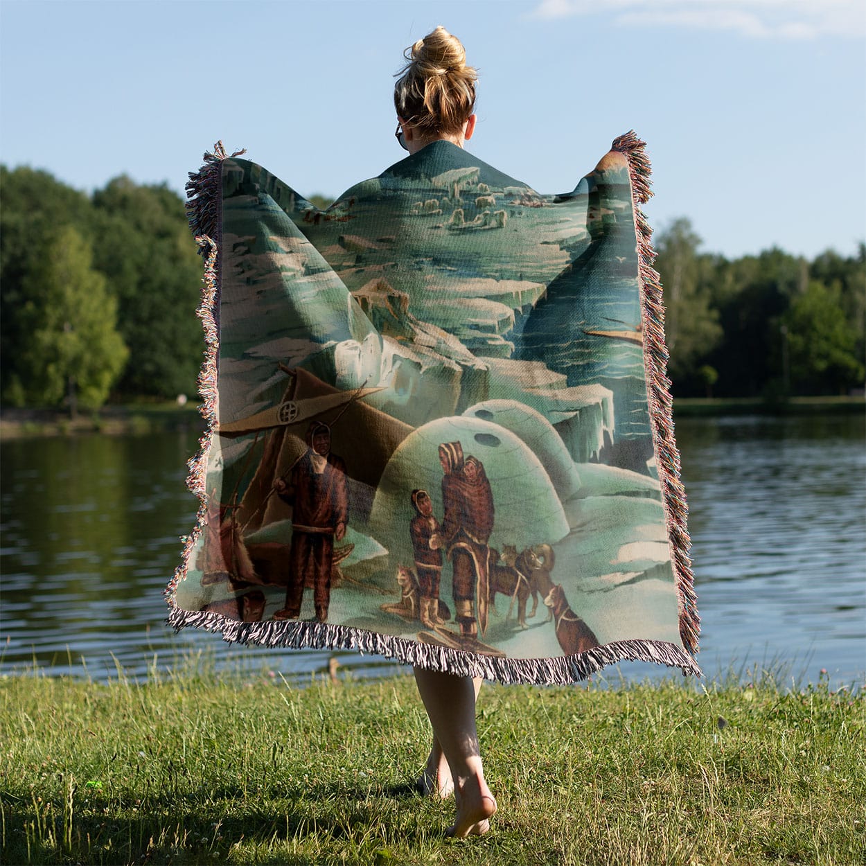 Polar Landscape Woven Blanket Held on a Woman's Back Outside