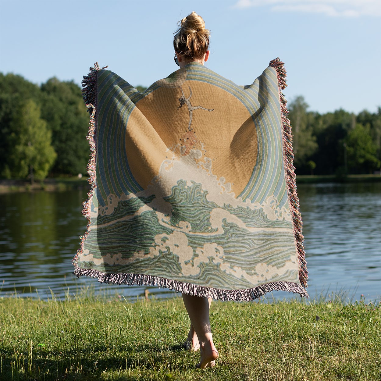 Reach for the Moon Woven Blanket Held on a Woman's Back Outside