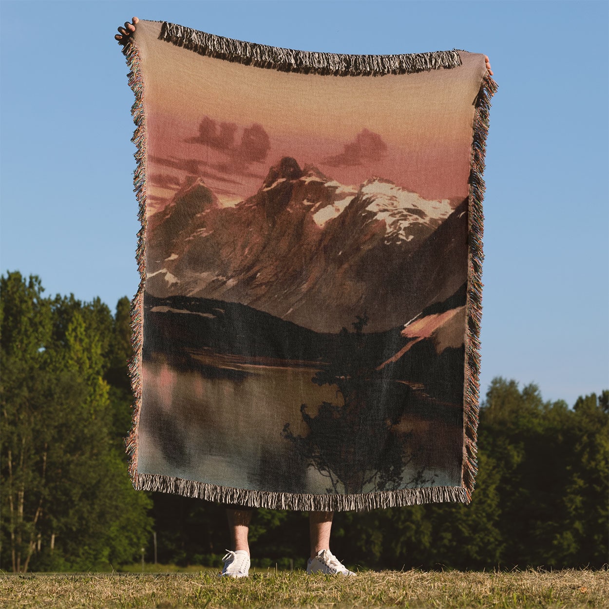 Red Mountain Sunset Woven Blanket Held Up Outside