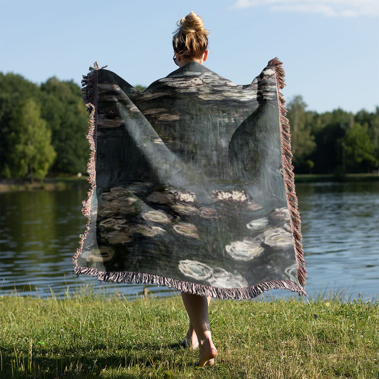 Relaxing Water Painting Woven Blanket Held on a Woman's Back Outside