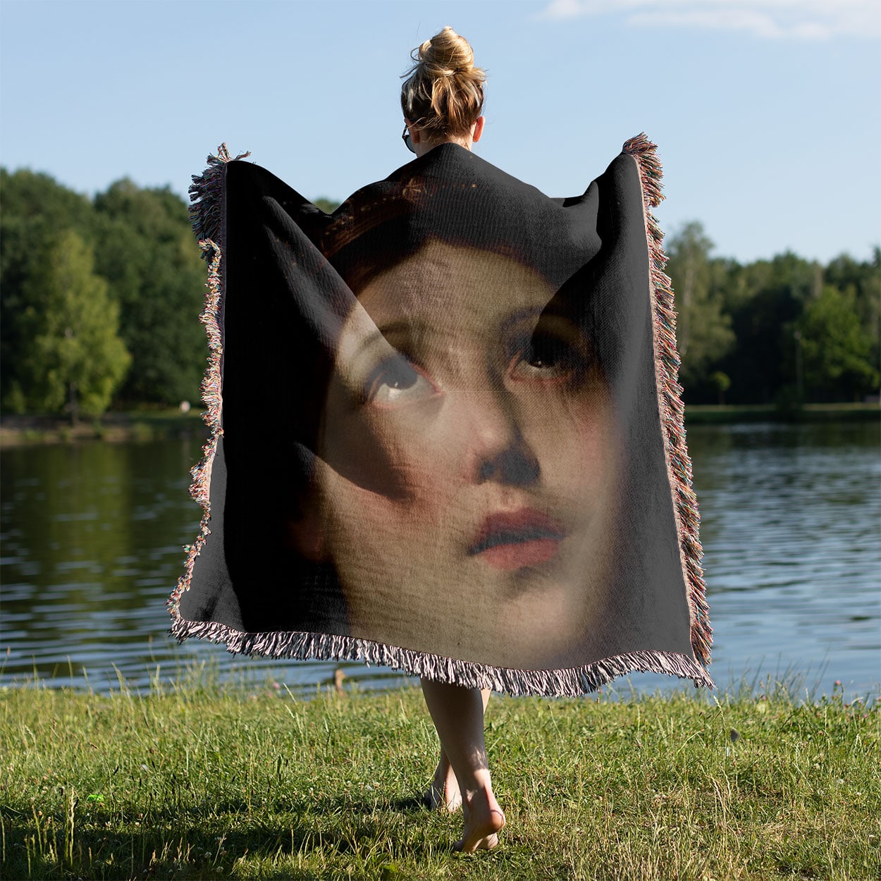 Renaissance Woven Blanket Held on a Woman's Back Outside