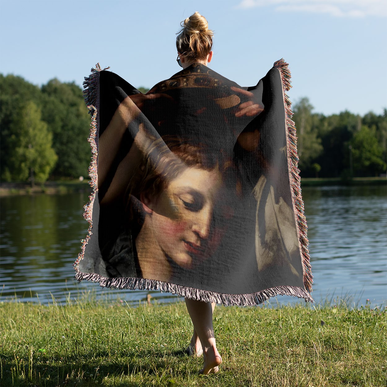 Renaissance Queen Woven Blanket Held on a Woman's Back Outside