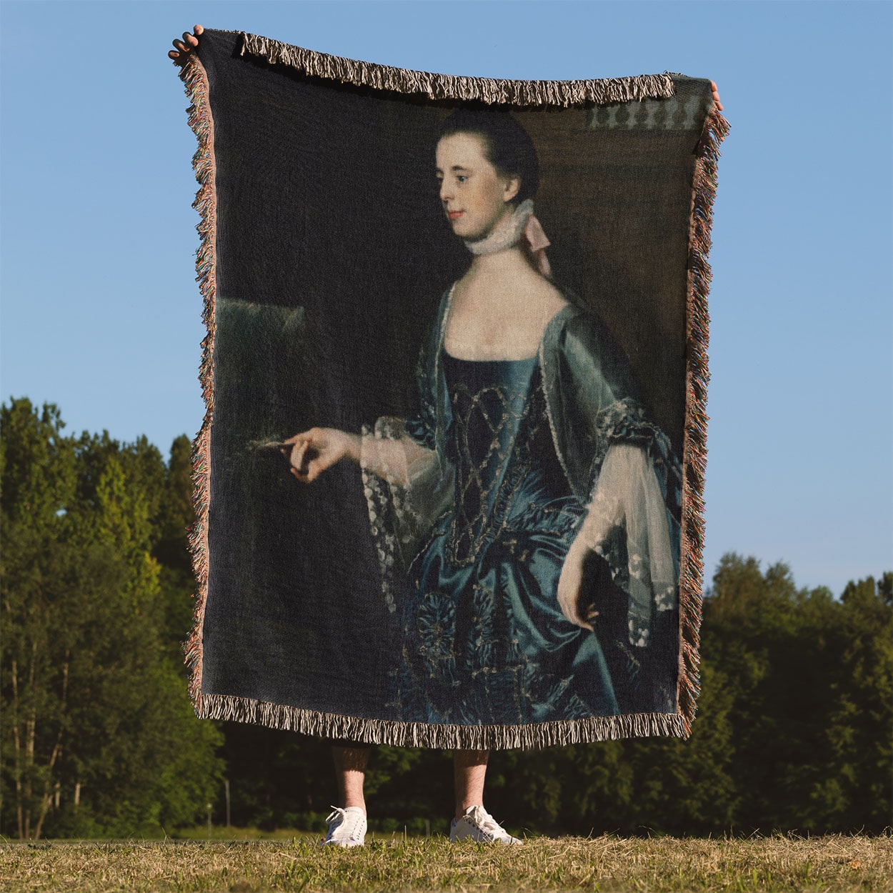 Renaissance Teacher Woven Blanket Held Up Outside