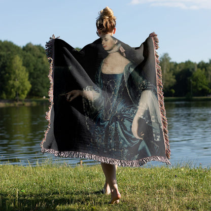 Renaissance Teacher Woven Blanket Held on a Woman's Back Outside