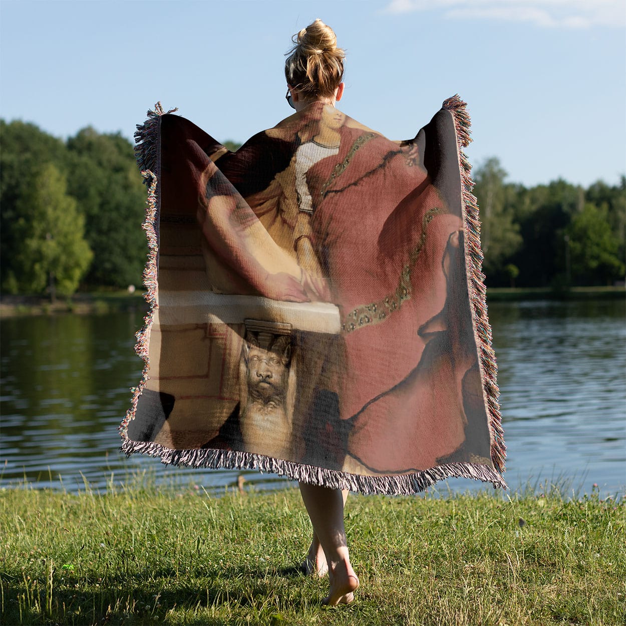 Renaissance Youth Woven Blanket Held on a Woman's Back Outside