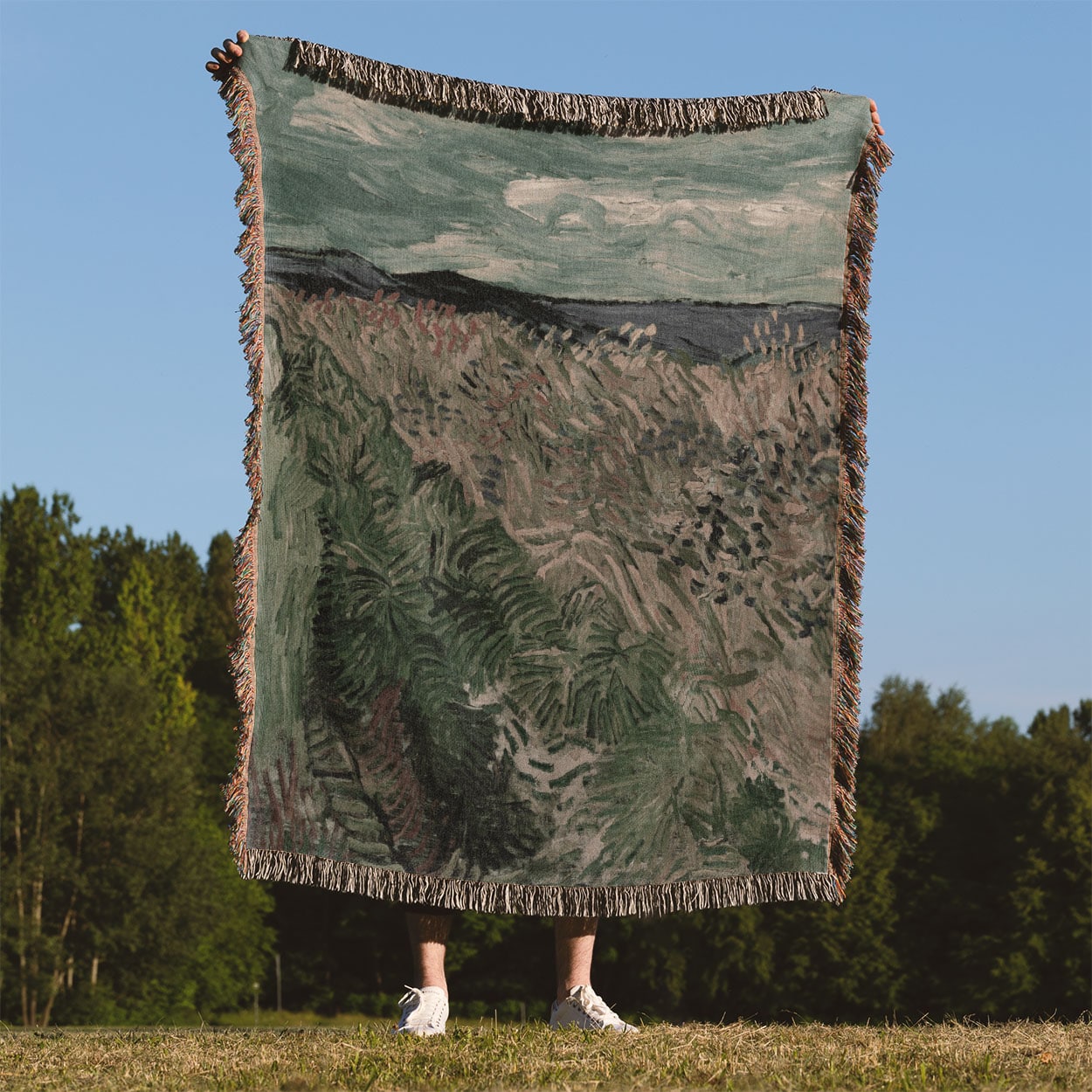 Revitalized Woven Blanket Held Up Outside