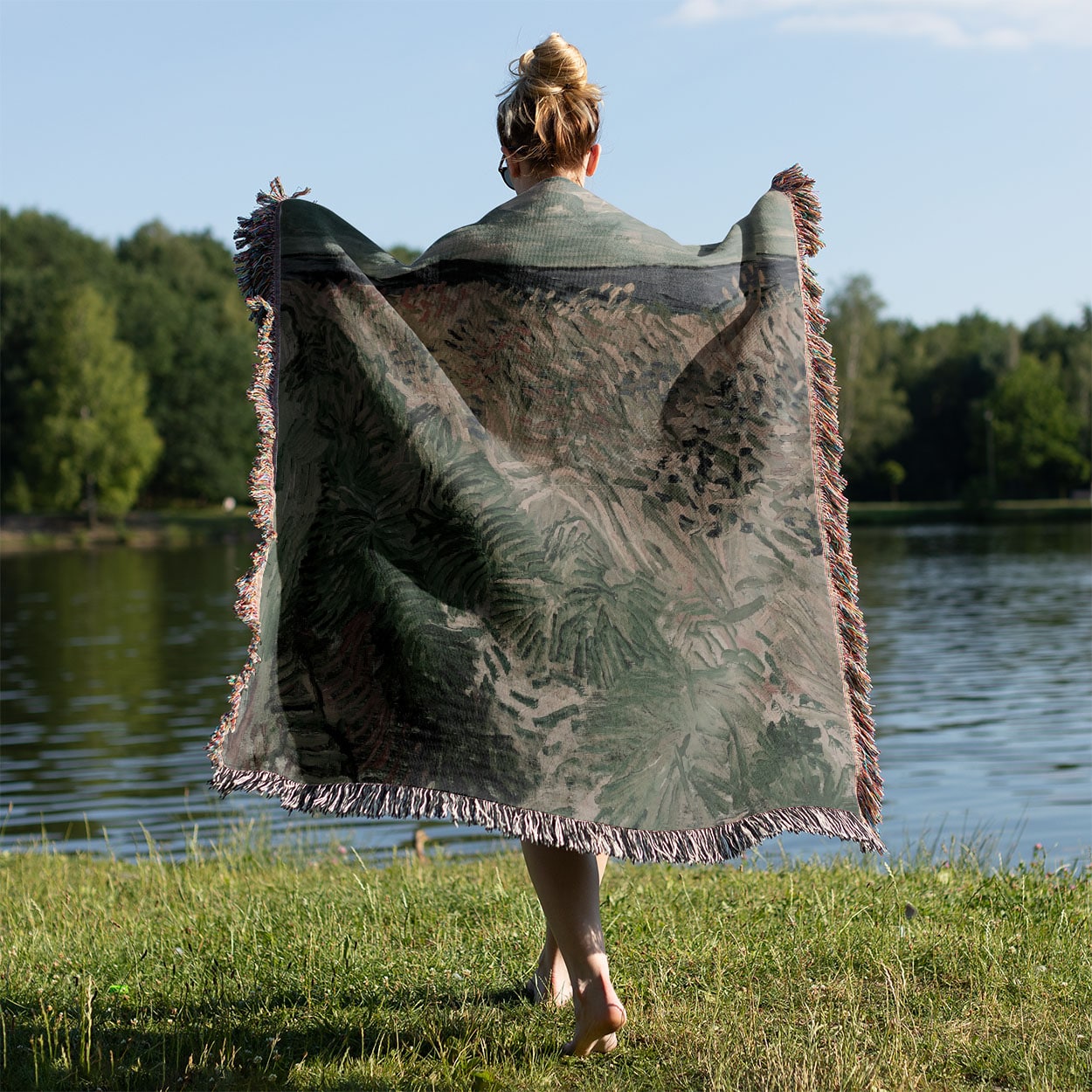 Revitalized Woven Blanket Held on a Woman's Back Outside