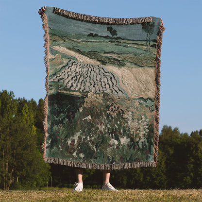 Rolling Hills Woven Blanket Held Up Outside