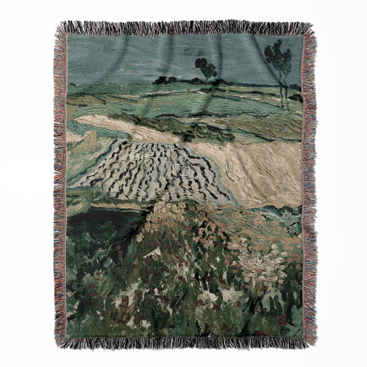 Rolling Hills woven throw blanket, made of 100% cotton, providing a soft and cozy texture with a muted sage green design for home decor.