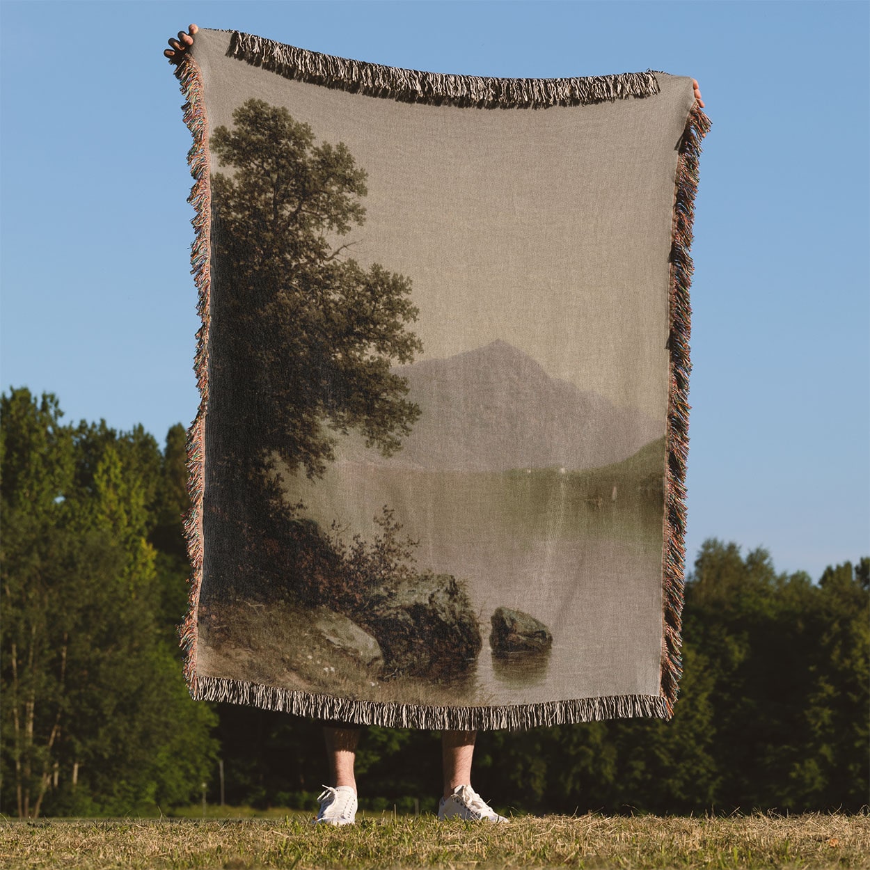 Sage Green Woven Throw Blanket Held Up Outside