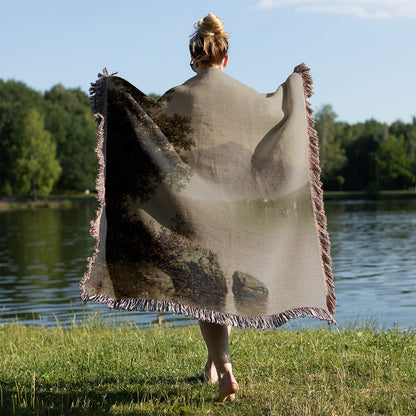 Sage Green Woven Throw Blanket Held on a Woman's Back Outside