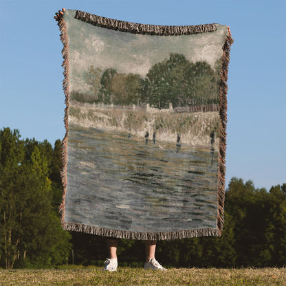 Sage Green Paris Woven Blanket Held Up Outside