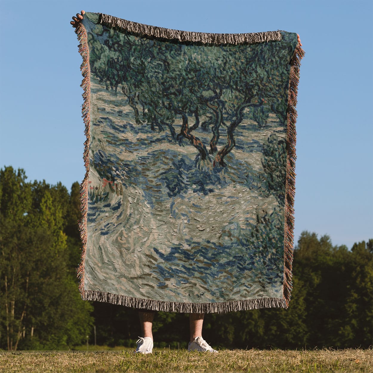 Sage Green Woven Blanket Held Up Outside