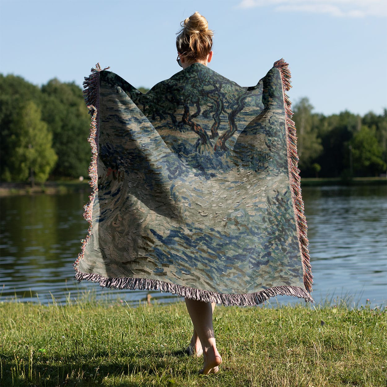 Sage Green Woven Throw Blanket Held on a Woman's Back Outside