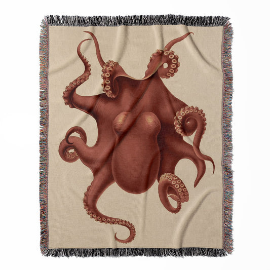 Sea Creature woven throw blanket, made of 100% cotton, featuring a soft and cozy texture with an orange-red octopus for home decor.
