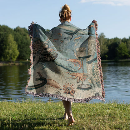 Sea Life Woven Blanket Held on a Woman's Back Outside