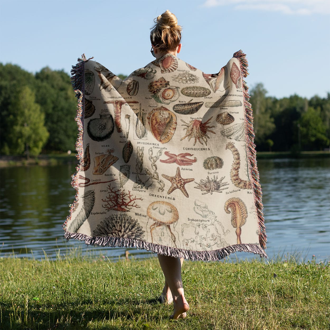 Seashells Woven Blanket Held on a Woman's Back Outside